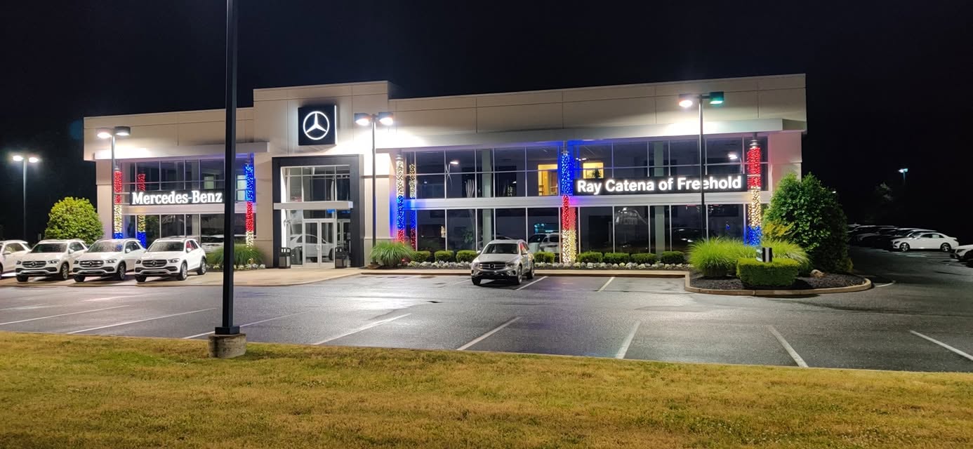 Commercial building with holiday lighting at night
