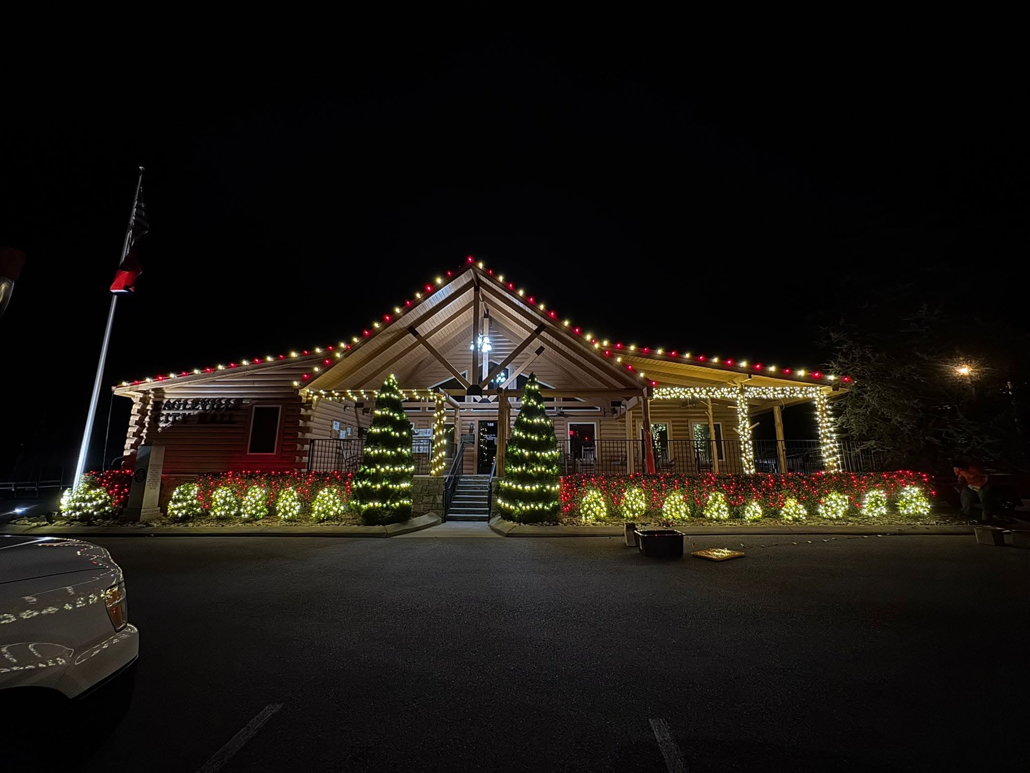 Ranch home with red and green Christmas lights