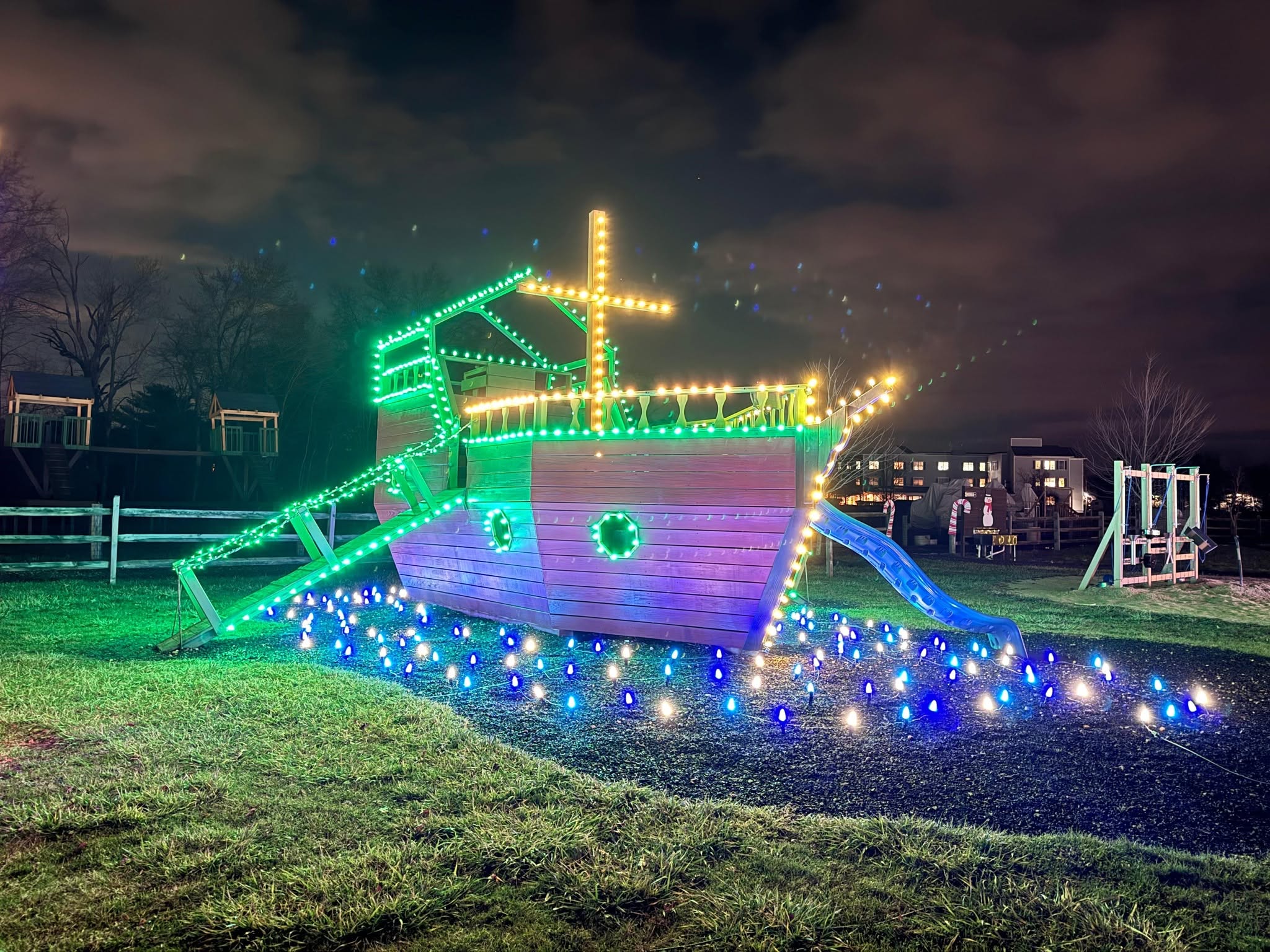 Ship shaped light display in green and blue